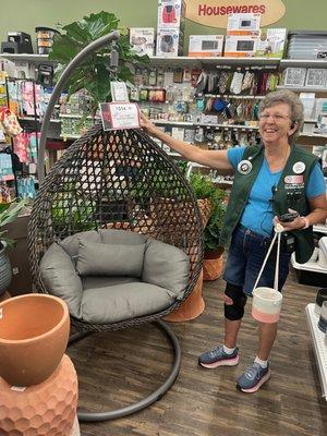 Jennie the best salesperson in the world featuring an outdoor hanging chair.