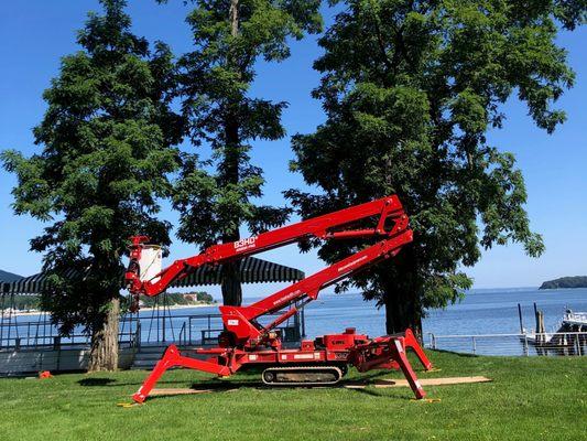 Tree Health's spider lift extends up to 83 ft to prune and remove trees in hard to reach locations.