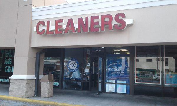 New Royal Cleaners sign with their logo in the front window.