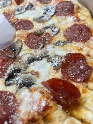 Pepperoni and mushroom pizza