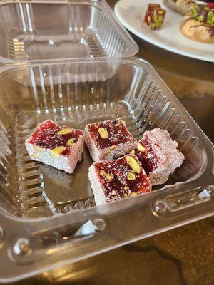 A to go box of jellied slices with pistachios. So delicious!