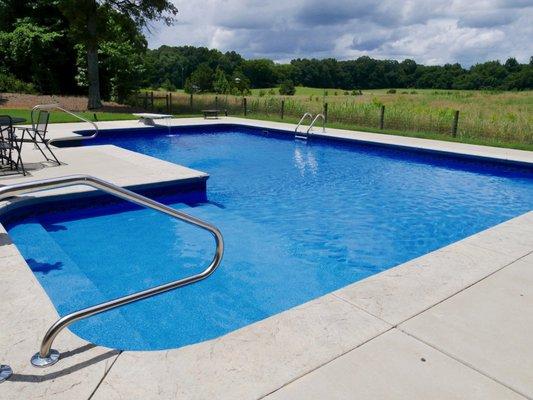 Perfect linear pool for friends and family featuring a diving board for splash fun and impressive flips.