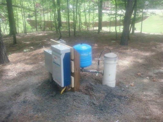 Residential drilled water well and outside well pump system in the North Atlanta Georgia area.