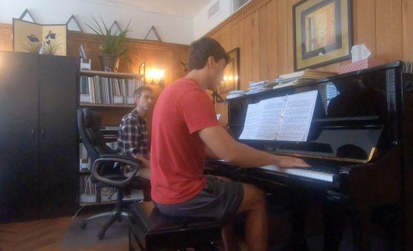 Student in piano lesson