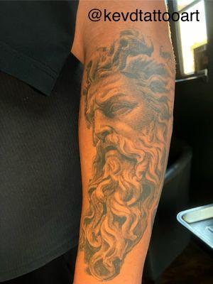 1 year healed black and grey zeus tattoo by @kevdtattooart