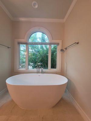 Remodel. Got rid of old garden tub and updated with solid freestanding tub and elegant telephone bath faucet.