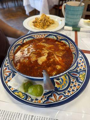 Menudo with a chorizo and egg taco in the back