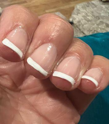 Ends of nails are rough, and nail polish is uneven.