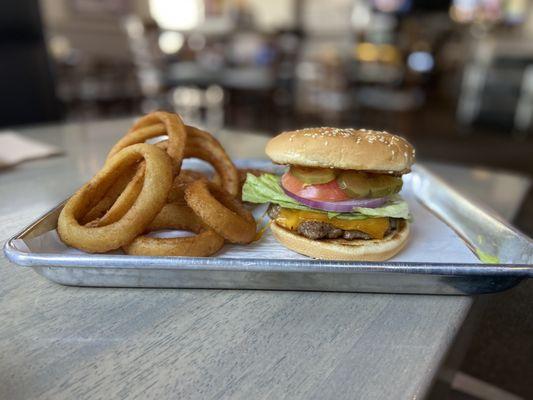 Johnny B's Cheeseburger and side of Onion Rings.