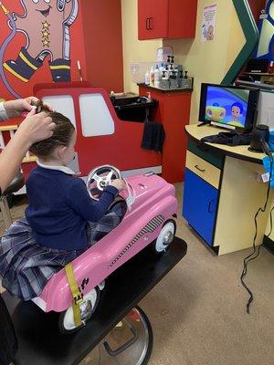 Brooklyn watching Bubble Guppies while she gets her hair cut!!