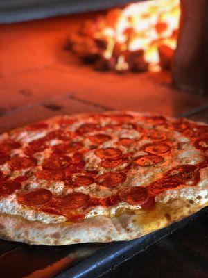 Delicious pepperoni and garlic pizza fresh out of the oven.