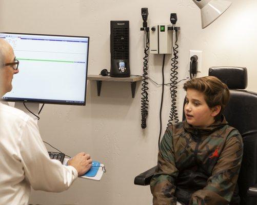 Dr. Heiner talking to a patient during an exam