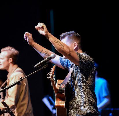 Tatted-up and worshiping Jesus! You can come as you are...suit not required!