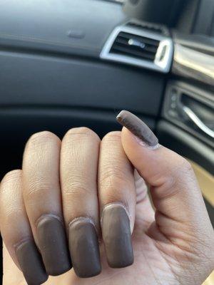 This is an $80 set of nails done on my 13 year old daughter yesterday. Such a poor job. The nails are not the same length and poor paint job