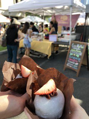 Izu's mochi tent and two large daifuku mochi with whole strawberries inside!