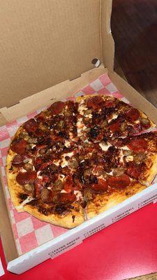 Meat lovers Pizza (pepperoni, sausage, and bacon)