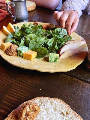 First course salad, cheese, fruit, and nut cakes.