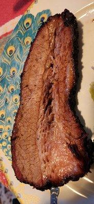 Slice of Tantrum BBQ smoked beef brisket from the fatty end of the brisket.