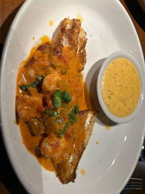 Orange roughy with Cajun shrimp sauce.