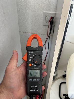 Testing GFCI outlet after replacement for residential service call in Tracy, California