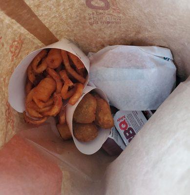 Spicy Fish Sandwich, Curly Fries, and Jalapeño Bites