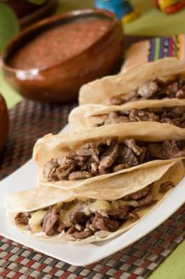 Our Top Sirloin Tacos melted with Cheese