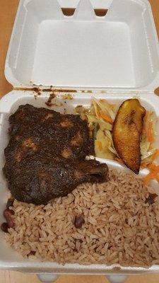 Jerk chicken plate. Comes with Caribbean rice w/beans, veggie and plantain. Very good.