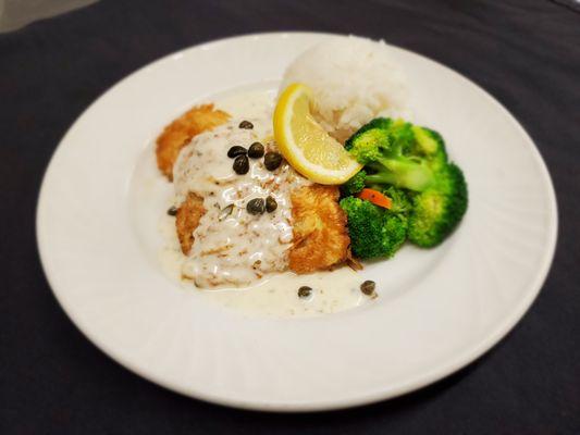 Chicken Piccata. Lightly egg battered and pan seared chicken with lemon caper butter sauce.