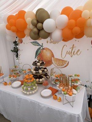 A dessert table with Bella Bakery goodies