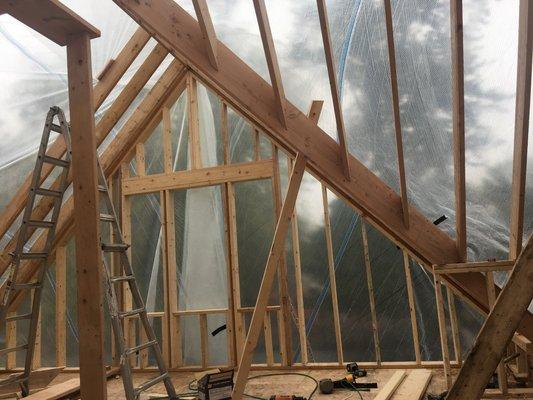 Gabled roof; Framing install after a couple trees fell on an owners house during a tornado.