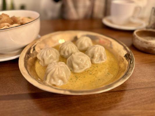 Pasture-raised Chicken Momos - Nepalese steamed dumplings, served with jhol achar, a flavorful sesame based sauce