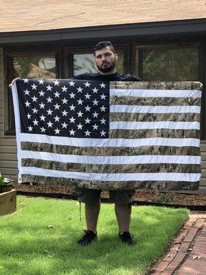 She took my sons  fatigues that he wore on deployments overseas and cut and sewed them on to the flag.