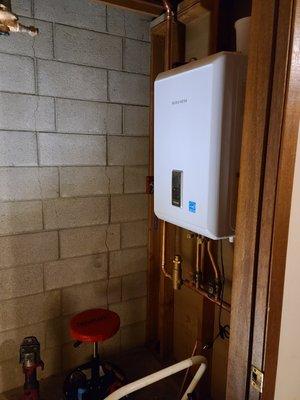 In with the new combi tankless boiler and domestic hot water system.