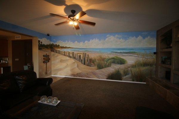 Beach Mural we painted in the Family Room for our clients. They love to visit the beach so we brought the beach to them!