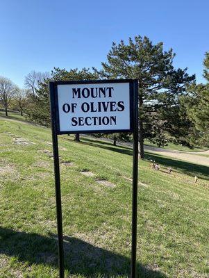 Sign marking a cemetery area burial ground location name.