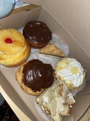 Chocolate doughnut, pineapple upside down cake, baklava, chocolate covered cream puff, banana bread, limoncello tart