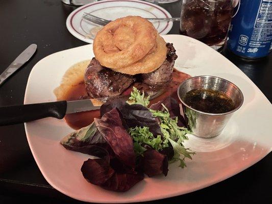 Filet with onion rings and salad garnish