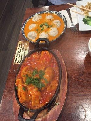 Chicken Momo sizzler on bottom, veg jhol Momo on top.