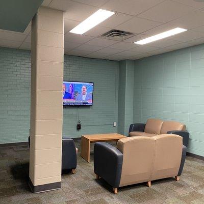 TV sitting area in locker room.