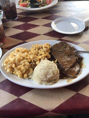 Roast beef with cream cheese corn, mac and cheese and mashed potatoes. Delicious.