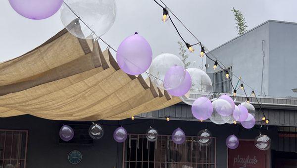 This bubble-themed party used clear, transparent balloons, and translucent shades, above the deck at PlayLab Eagle Rock indoor playspace