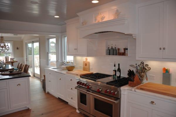 This Beaded white lacquer kitchen has furniture toe base, also beautiful focal point. to give it that classic charm. Down to the last detail