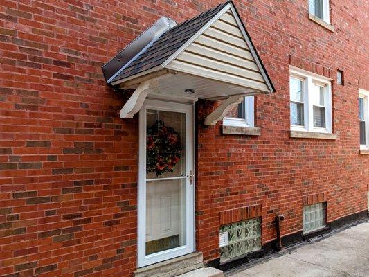 Side door awning repaired, brand new roof, flashing, drip edge and soffit. Properly sealed, secured and cleaned.