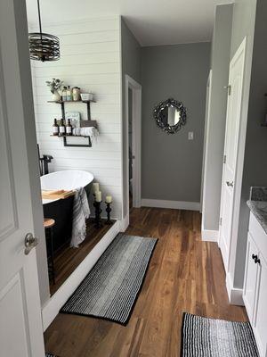 They put flooring in the entire house but here is a pic of my bathroom! We finally got the tub installed.