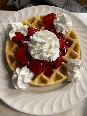 Waffles with strawberries and whipped cream