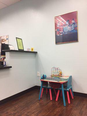 Front desk and small area for little kids to play.