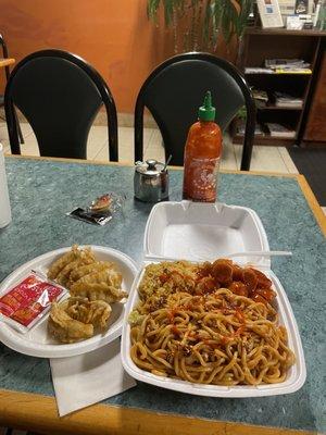 Pork, chow mein and fried rice and orange chicken potstickers