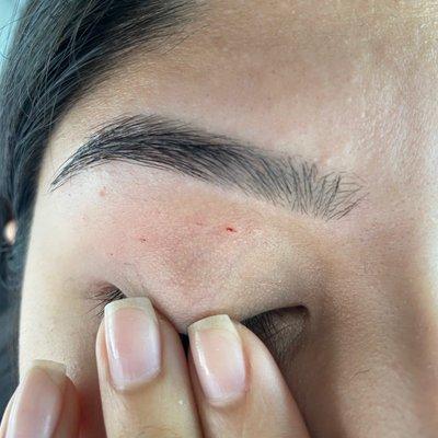 cut different parts with string, not careful and rough (causing uneven eyebrows.) some hairs still left can be seen on lower brow.