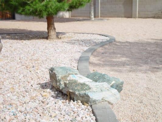 large boulders added to curbing