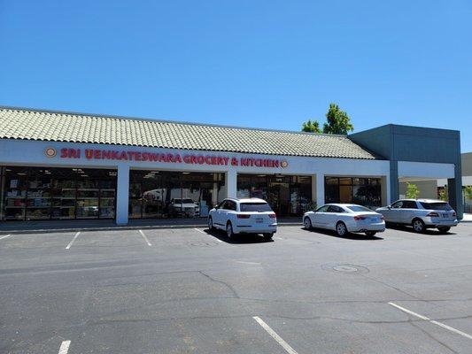 The restaurant is at the right end of the grocery store